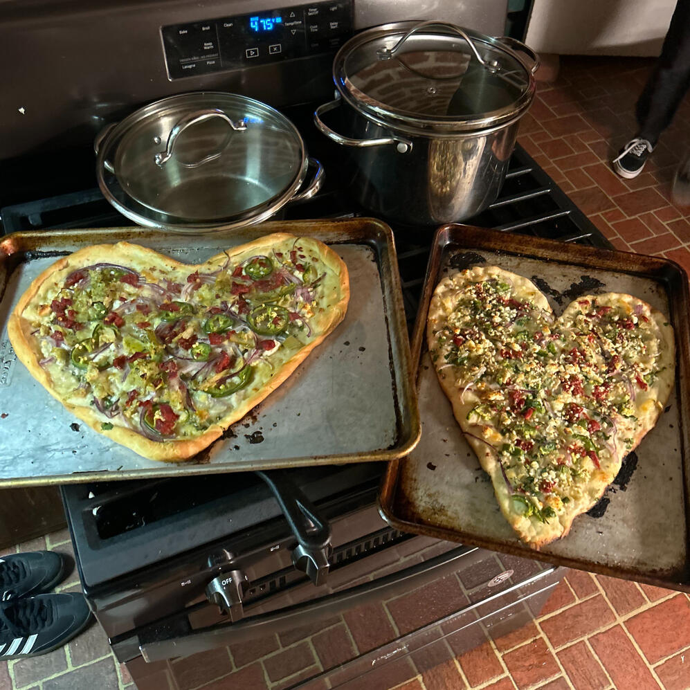 Pizzas with Mozzarella, Red Onion, Jalapeño, Artichoke Hearts, Peppers, Garlic, and Cotija